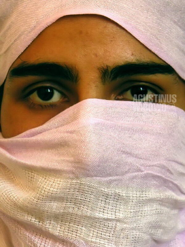 A portrait of a member of Revolutionary Association of the Women of Afghanistan (RAWA). It is still a forbidden organization in Afghanistan due to its revolutionary and political motives. RAWA was vocal against the communist Soviet invasion, but also against Islamic radicalization in Afghanistan. RAWA has published shocking reports to expose extreme hostility towards women conducted by the Taliban regime. Due to its underground nature, the members of RAWA movement keeps their secrecy and very cautious in exposing their activity.  Kabul, Afghanistan, 2006